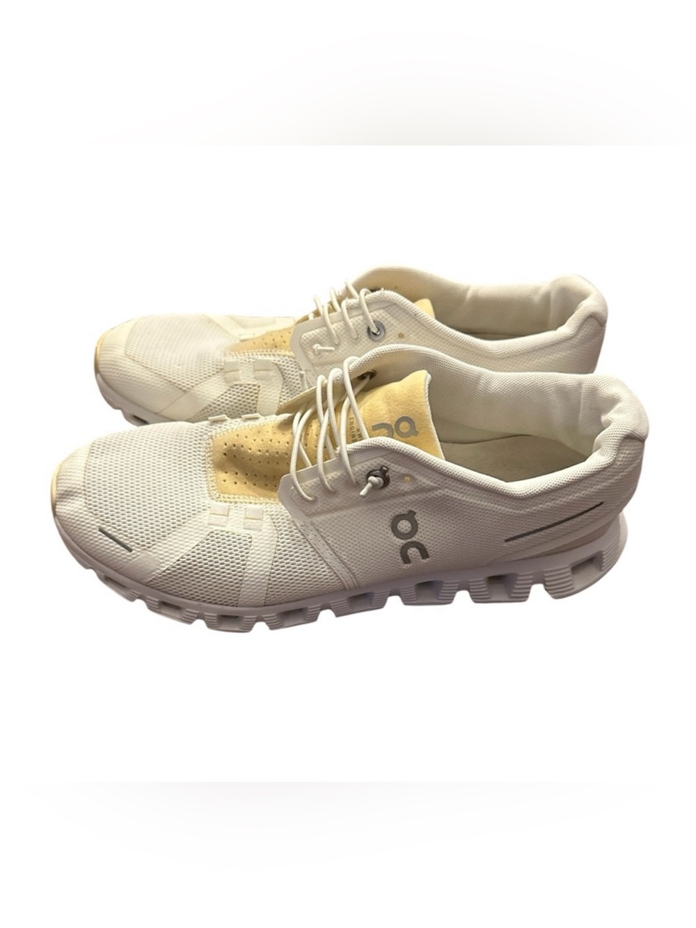 On Running White and Light Yellow Athletic Shoes